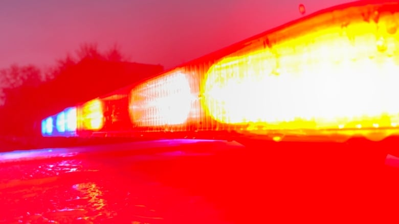 A closeup of flashing lights atop a police car.