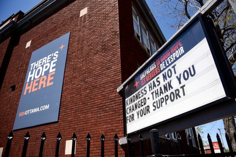 A sign outside a shelter thanks people for support.