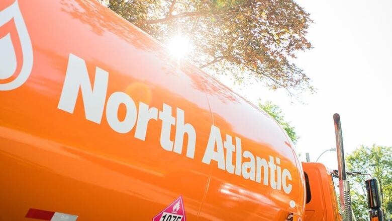 A bright orange North Atlantic fuel truck.