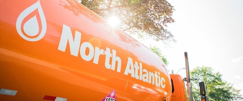 A bright orange North Atlantic fuel truck.