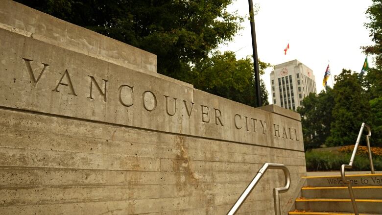 A stone slab with the words 'Vancouver City Hall.'