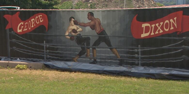 A mural of two boxers fighting in a rings