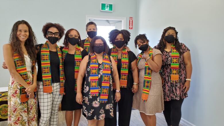 A group of people wearing colourful scarves