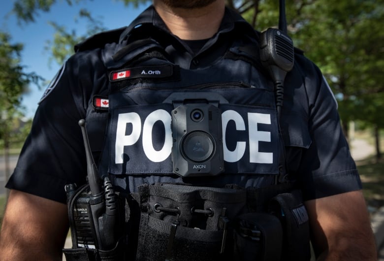 Members of the Toronto Police Service demonstrate new body-worn cameras outside 23 Division. The cameras are made by Axon Enterprise, Inc.