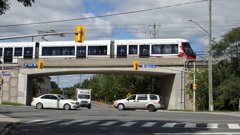 An LRT train crosses Bayview Avenue in Ottawa just west of Bayview station in September 2020.