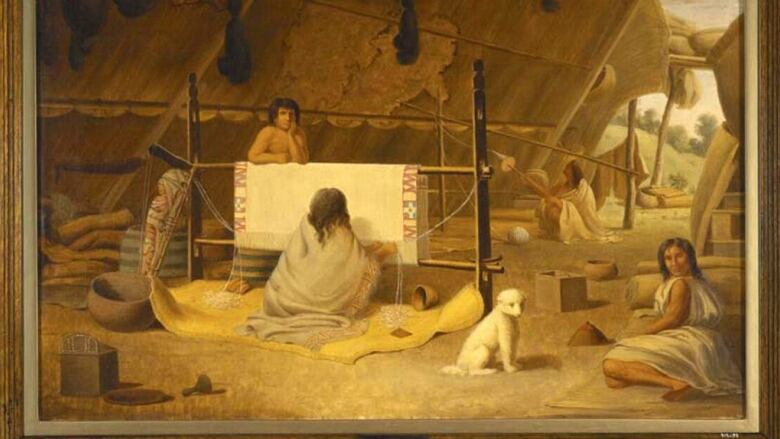 A painting shows four Indigenous people, one of them weaving a blanket, and a small white dog. 