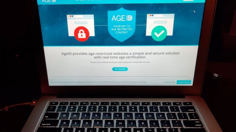 This photo taken in London on Monday July 8, 2019, shows a laptop screen displaying the website for AgeID, an age verification system for the British governments planned online porn block