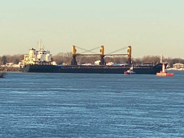 A large ship crosses the Detroit River. 