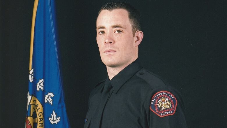 Sgy. Andrew Harnett posing in his Calgary Police Service uniform.