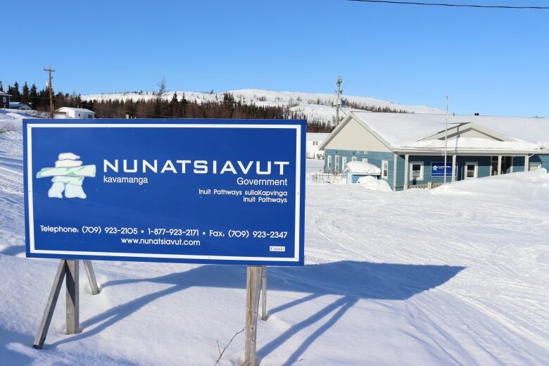 A blue sign with the words Nunatsiavut Government on it.