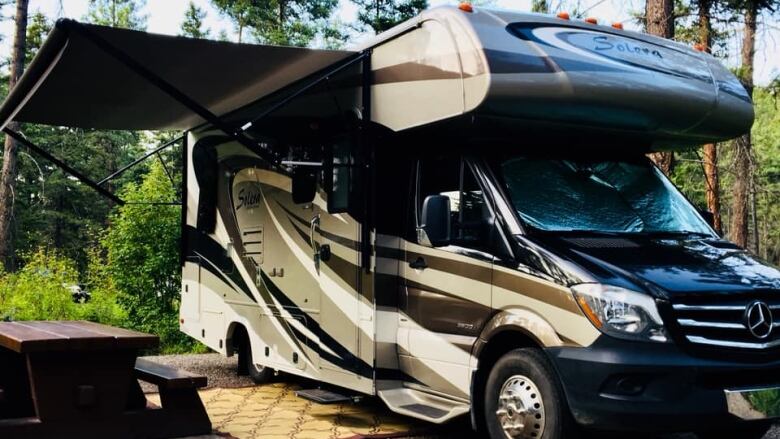 A motor home is pictured in an Alberta campsite. 