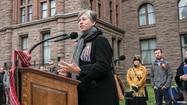 Margaret Froh speaks at a rally.