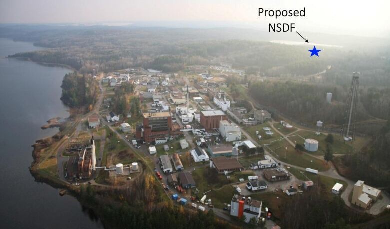 A research lab from the air, with a star marking a waste dump site west of the site.