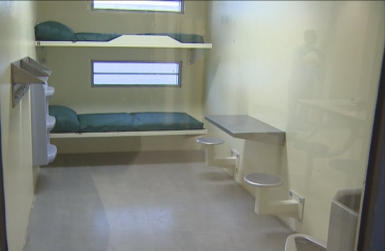 jail cell with two beds