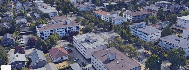 A number of flat buildings along a street in Victoria.