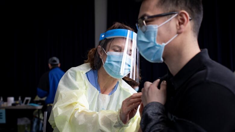 A Toronto resident gets a dose of the COVID-19 vaccine at a clinic in April 2021.