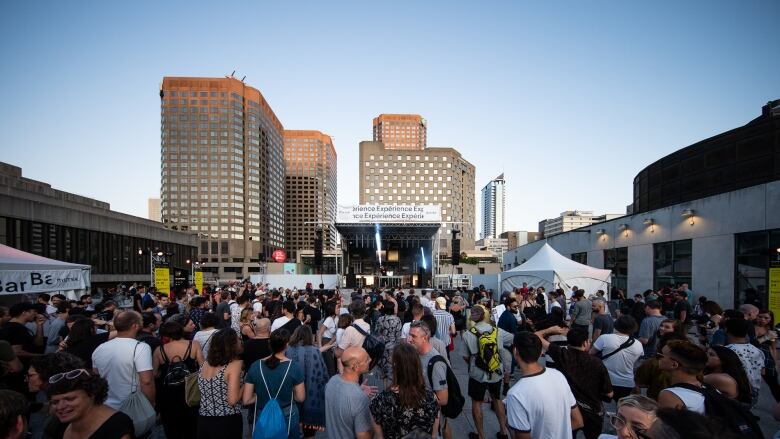 people dancing at an outdoor music festival downtown Montreal