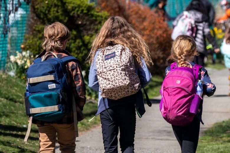 Students are pictured after school at Van Horne Elementary school in Vancouver, British Columbia on Monday, April 12, 2021. 