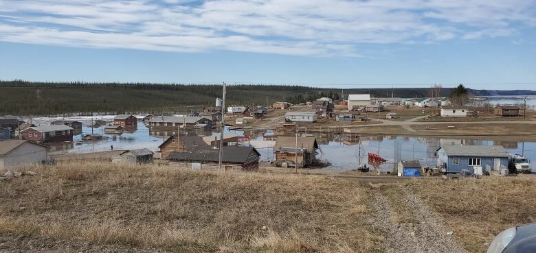 The roads of a small town are seen flooded with water.