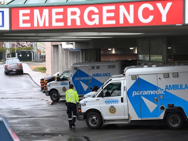 Ambulances sit at the emergency room entrance at the Michael Garron Hospital.