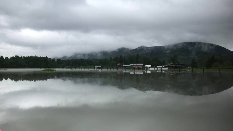 A swath of river water with mountains as background.