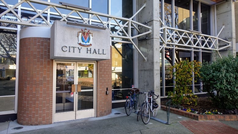 Victoria City Hall, with two bicycles outside it.