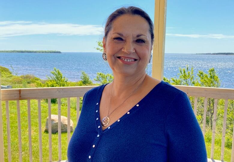 Lennox Island First Nation Chief Darlene Bernard, on a deck overlooking the water.