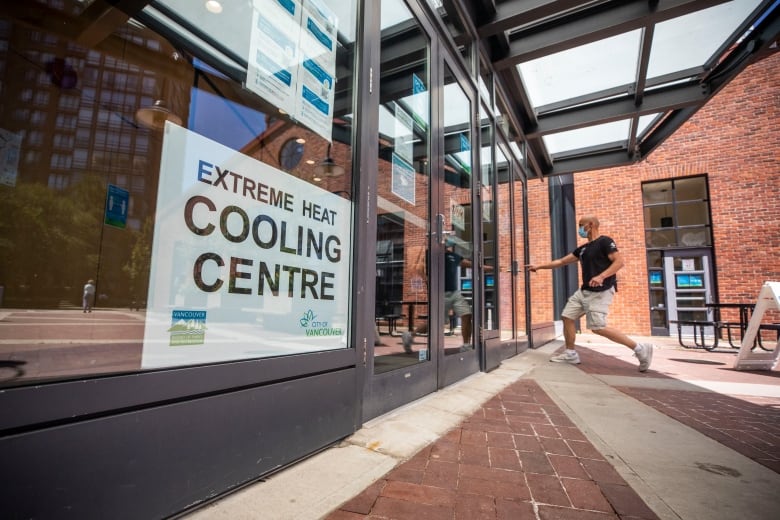 A man heads into a cooling centre set up by the City of Vancouver to help people stay cool during extreme heat. 