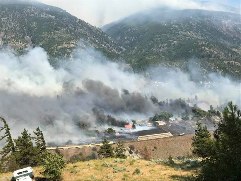 smoke rises from the ground in Lytton