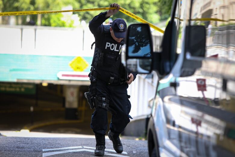 Toronto police conduct an investigation where Const. Jeffrey Northrupwas killed in the parking garage at city hall on July 2, 2021.