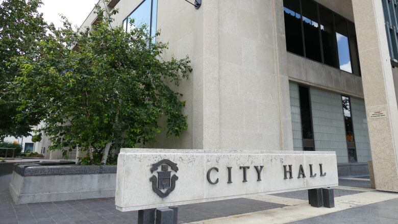 A sign says City Hall