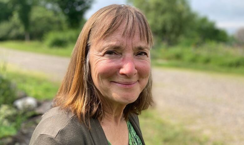 Louise Comeau smiles at the camera.