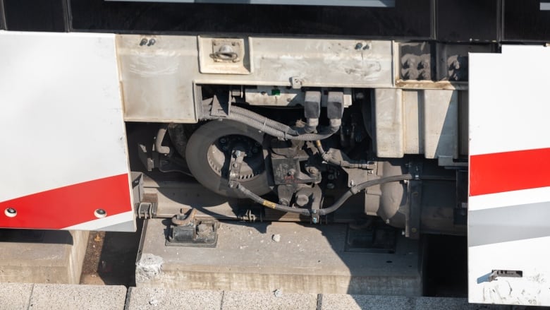 A picture of a train where a panel has been removed to show components.