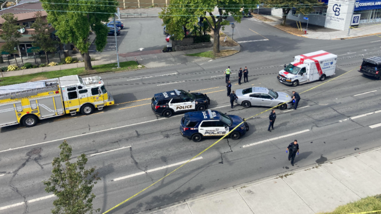 A overhead view of emergency response vehicles in the middle of a six-lane road.