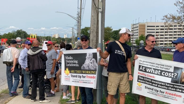 Protesters stood outside of Victoria Hospital in London to protest the vaccine mandate on Monday.