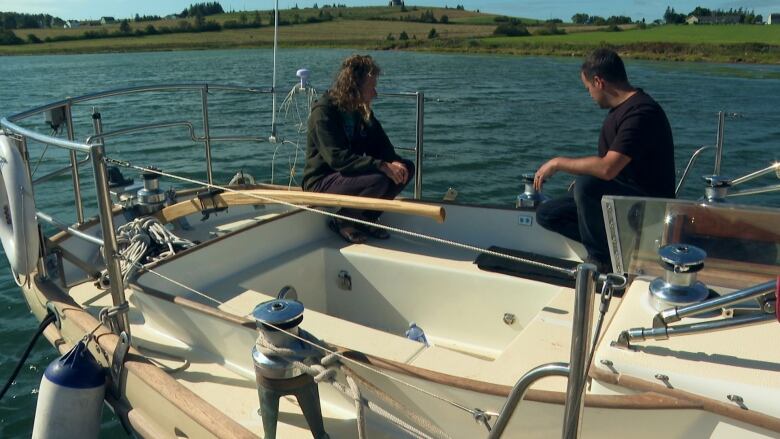 man and woman on a boat