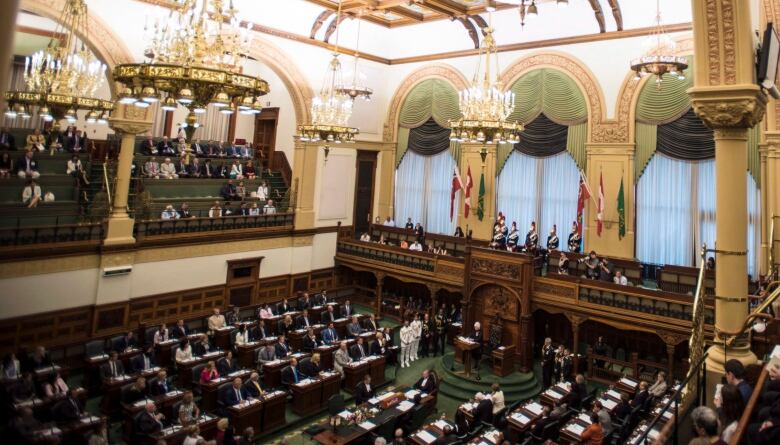 View from above of MPPs sitting inside the Ontario Legislature.  