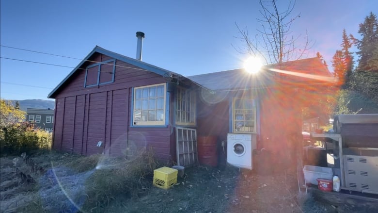 A purple cabin with blue trim.