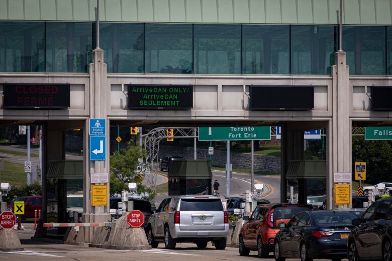 Cars bound for Canada line the Rainbow International Bridge, in Niagara Falls, on Aug. 9, 2021. Canada now allows fully vaccinated Americans to both enter the country and skip the previously mandatory 14-day quarantine period as part of an easing of COVID-19 restrictions on travel.