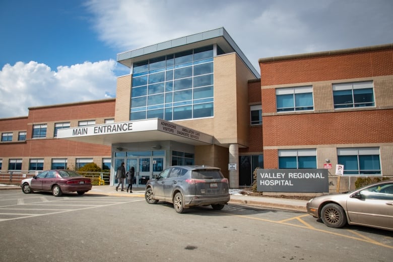 an exterior view of a hospital on a clear day.