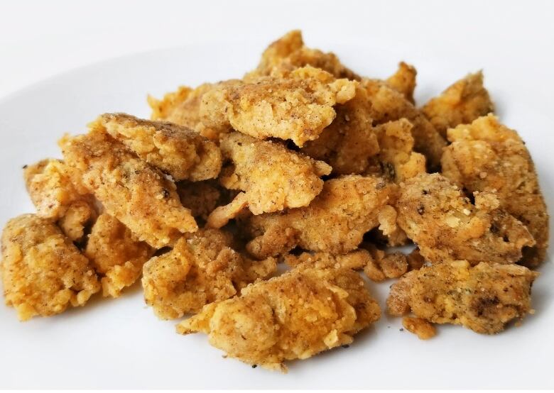 Dandelion fritters on a plate.