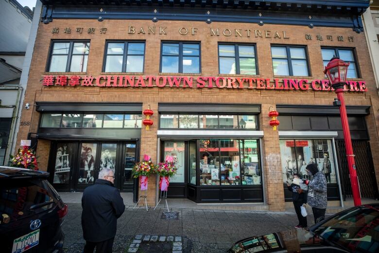 A brown building with the name 'Chinatown Storytelling Centre' written in red text, as well as Chinese characters.