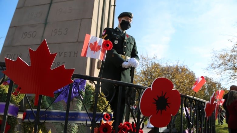 Man standing near Remembrance Day set up.