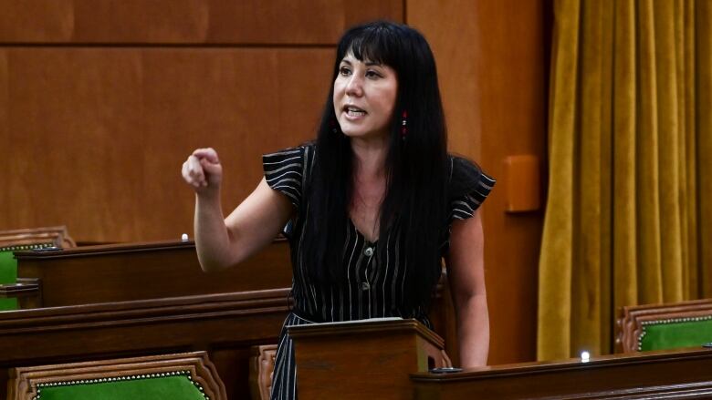 A politician points while giving a speech.