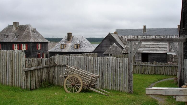 A group of old homes, some made of wood