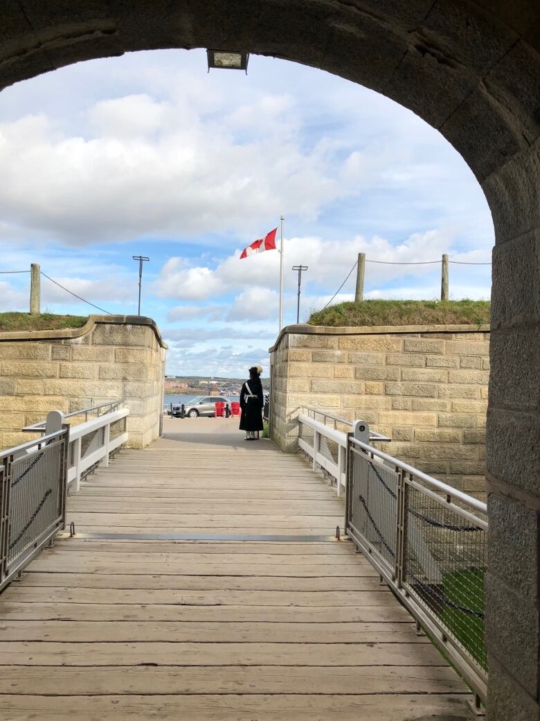 A wooden board walk in the middle of a stone fortress