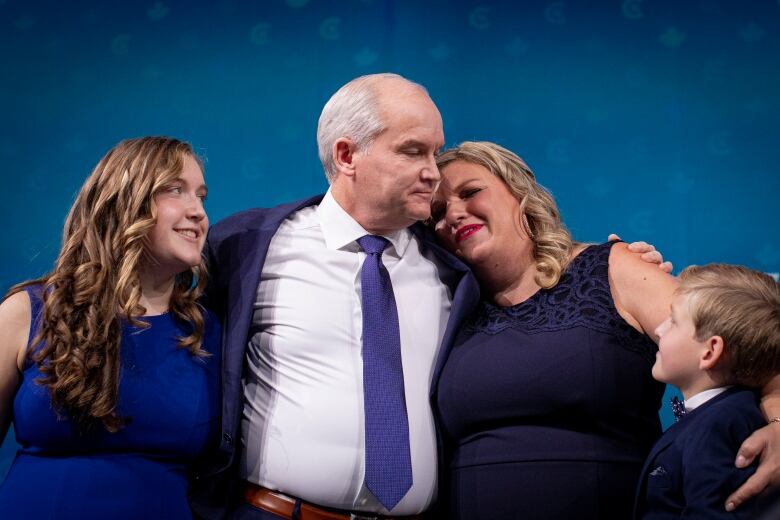 Erin O'Toole hugs his family after the 2021 election.