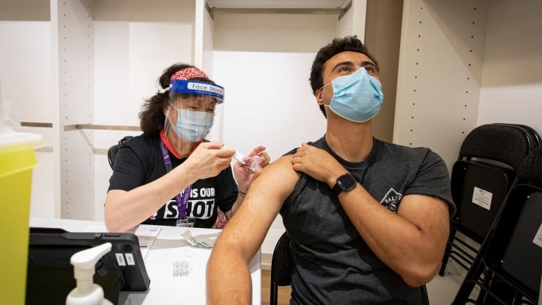 A person being vaccinated.