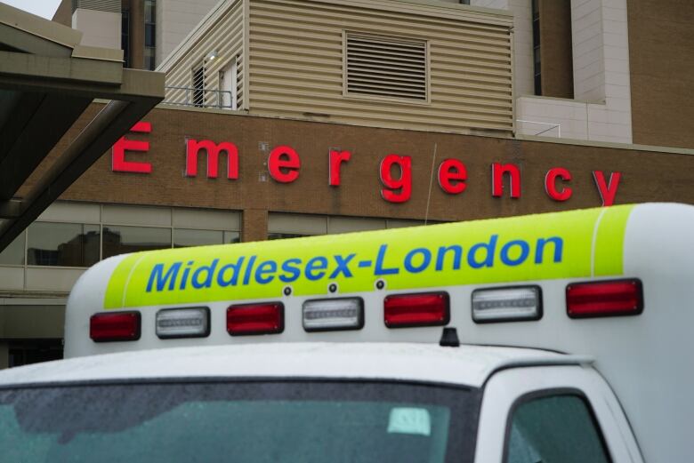 An ambulance is parked outside the emergency department at the Victoria campus of the London Health Sciences Centre. The hospital has seen a sudden surge of COVID-19 patients thanks to the fast-spreading Omicron virus. 