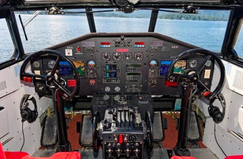 controls and steering wheels inside a plane